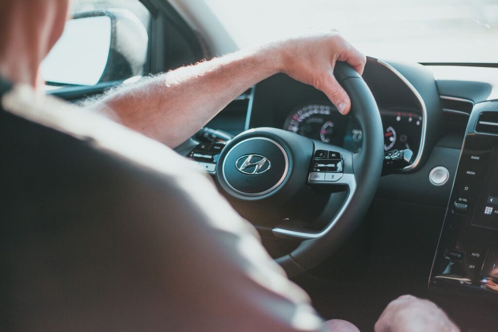 A driver at the wheel of a private hire car