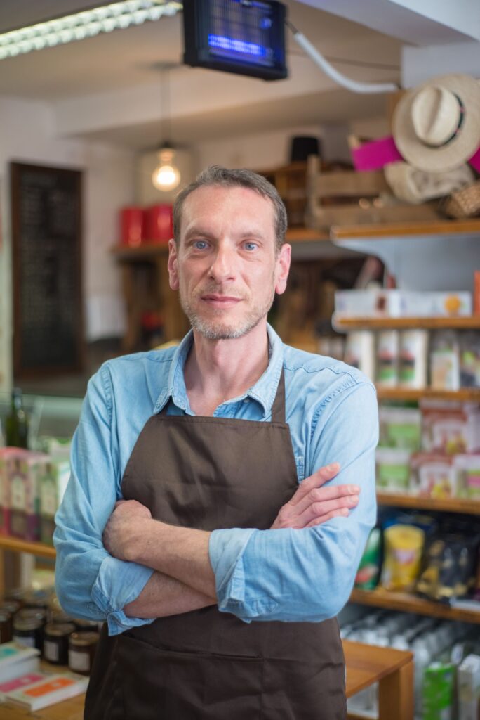 Independent business owner standing in their own shop